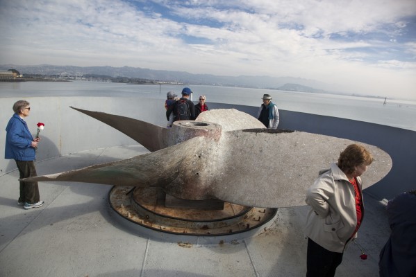 Visitors explore the SS Red Oak Victory prior to the memorial flower wreath toss. (Photo by: Mark Andrew Boyer)